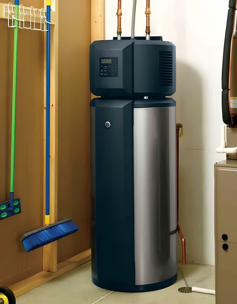 Heat Pump Water Heater in a Utility Room; Black and Stainless Steel — Corrimal Plumbing Services in Woonona, NSW