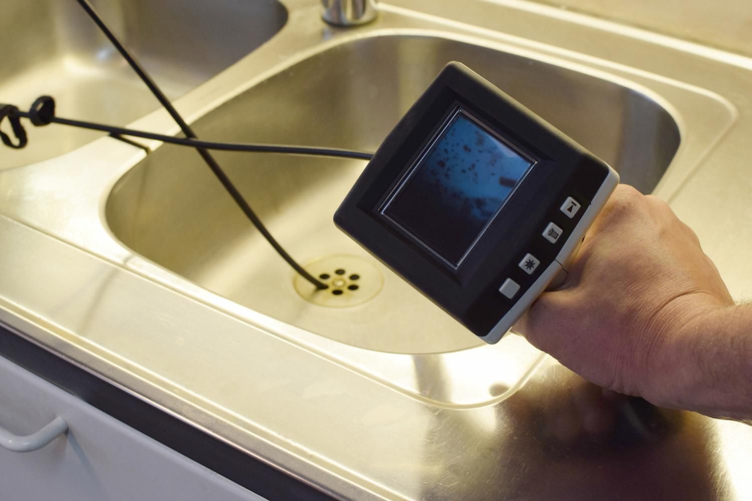 Plumber In Bulli Inspecting A Kitchen Drain With A Camera