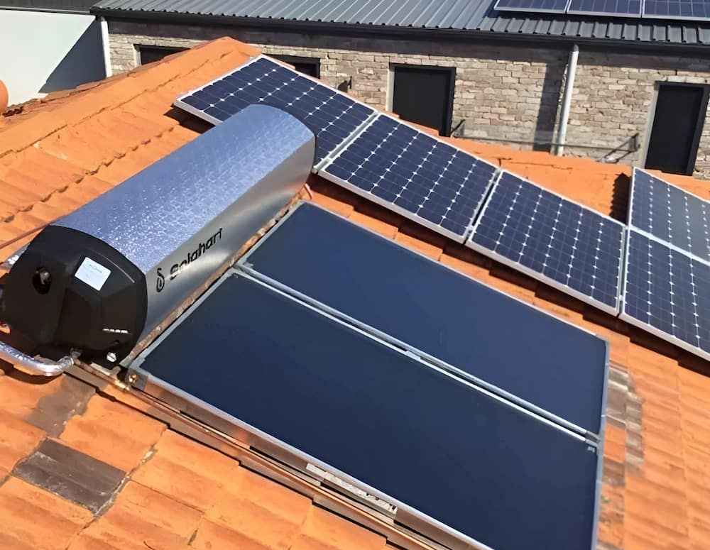 Solar Thermal Panels and Photovoltaic Panels on a Terracotta Roof — Corrimal Plumbing Services in Shellharbour, NSW